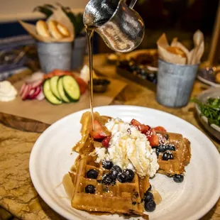 Belgian Waffle: Housemade Malted Waffle, Confectioners Sugar, Whipped Cream. Strawberries and Blueberries as add-ons.