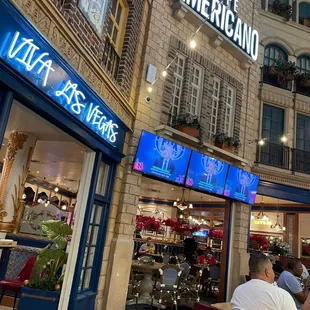 people sitting at tables outside