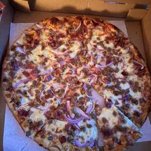 Large cheese pizza with sausage, prosciutto &amp; red onion