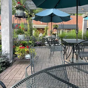 patio area with tables and umbrellas