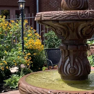 a fountain in a garden