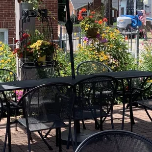 tables and chairs with an umbrella