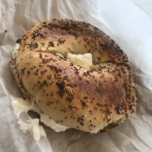a bagel with cream cheese on it