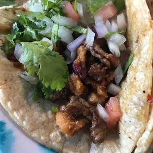 As close to the meat as you can get without getting your eye wet.