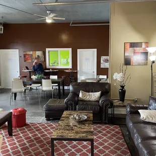 a living room with leather furniture