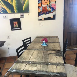 a wooden table and chairs