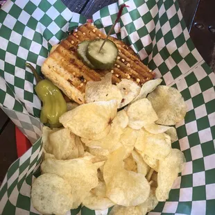 a basket of chips and a sandwich