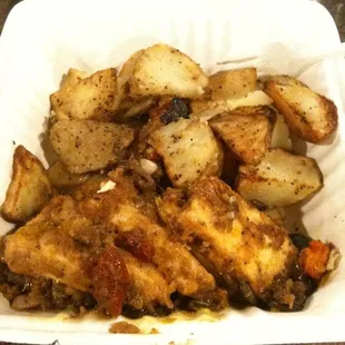 chicken and potatoes in a styrofoam container