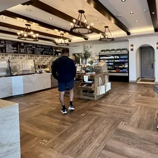 a man walking through a cafe