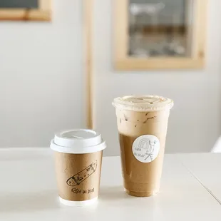 two coffee cups on a table