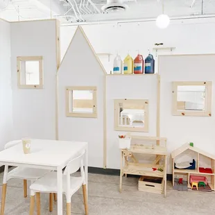 a table and chairs in a playroom