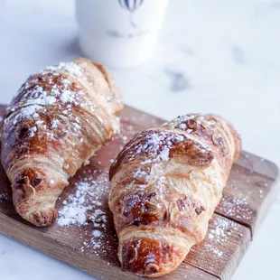 two croissants on a cutting board