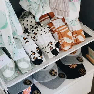 a display of baby clothes and accessories