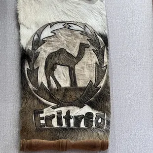a deer in a circle on a wall hanging
