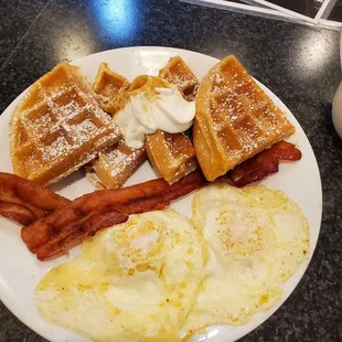 Waffles, eggs and bacon.