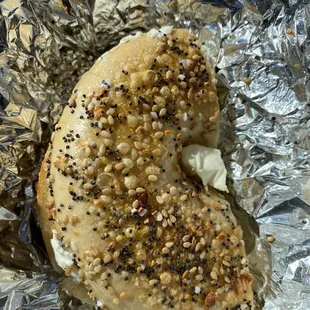 Supreme bagel with butter and cream cheese