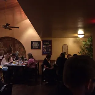 a group of people sitting at a table