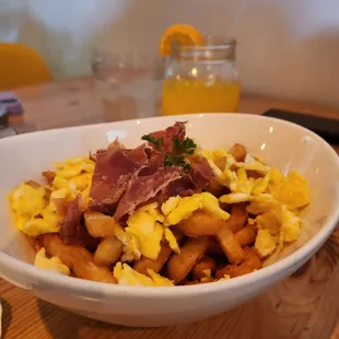 a bowl of scrambled eggs and bacon