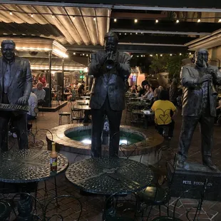 a group of statues of musicians