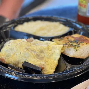 Crawfish Omelette with Grits and French Bread