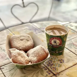 Left: beignets (3 for $4.75). Right: cafe au lait ($4.04)