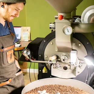 a man making coffee beans