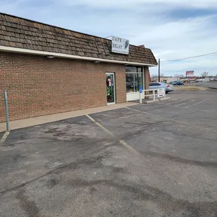 The sign is too small. Right next to Walgreen, Verizon, and salon.