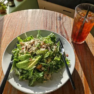 a plate of salad and a drink