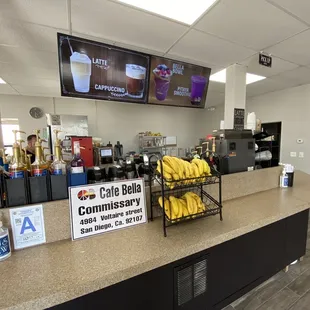 a counter with a bunch of bananas on it