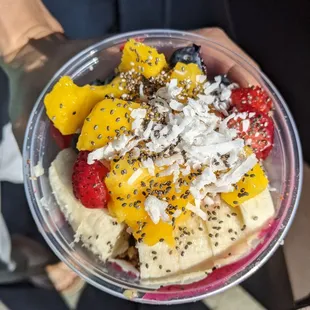 a bowl of fruit and nuts