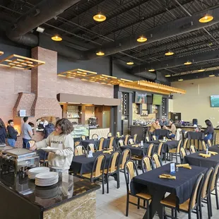 people eating at tables in a restaurant