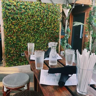 a table with drinks and paper straws
