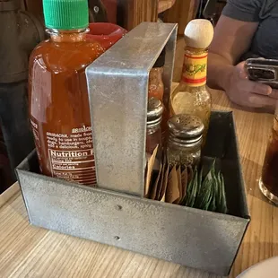 Siracha and other hot sauces at every table