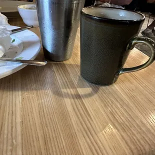 ceramic coffee mig and metal water glass