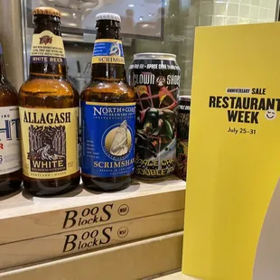 a variety of beer bottles on display