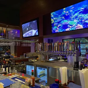 a bar with a large screen tv