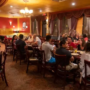 a large group of people sitting at tables