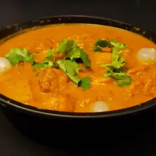 Vindaloo
A fiery and tangy Indian curry dish known for its intense flavors, traditionally made with a spicy blend of vinegar-marinated meat