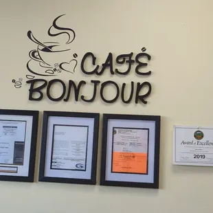 three framed photos of a coffee shop