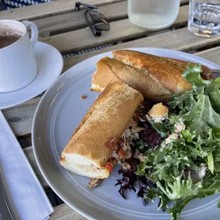 a plate of food and a cup of coffee