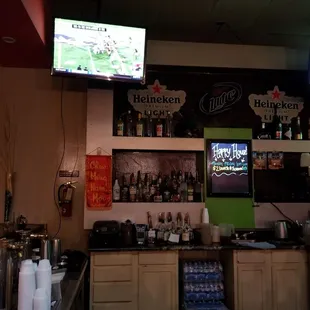 the bar area with a television