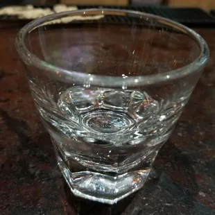 a glass of water on a table