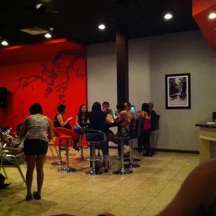 a group of people sitting at tables