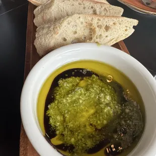 Bread service with olive oil, pesto and balsamic with their incredible home made bread