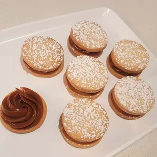 a plate of cookies with chocolate frosting