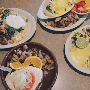 Furthest to closest: crab meat Benedict, Omelette aracaju, Omelette marinheiro, and beef a cavalo