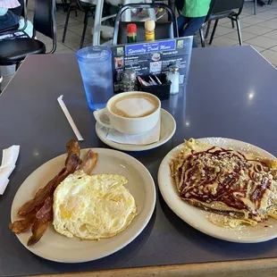 Classic Breakfast eggs over easy, 3 strips bacon and pancrepes with raspberry cream sauce. Also a &quot;Snickers Bar&quot; flavored latte.