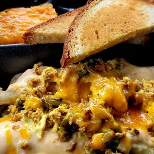 Mexican omelet with potatoe casserole and bread.