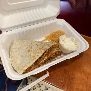 a meal in a styrofoam container