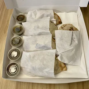 a box of pita chips and sauces